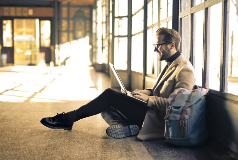 man choosing blue light blocking glasses online